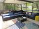 Cozy screened-in patio with comfortable seating and stylish decor, perfect for relaxing and entertaining outdoors at 2742 Pine Acres Dr, Lake Wales, FL 33898