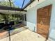 Convenient outdoor shower on screened patio, offering a refreshing rinse after a swim in the pool at 2742 Pine Acres Dr, Lake Wales, FL 33898