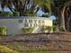 Elegant Winter Ridge community sign set amongst lush landscaping, enhancing curb appeal at 294 Winter Ridge Blvd # 294, Winter Haven, FL 33881