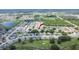 Aerial view of a home with a red arrow pointing to it in a neighborhood near a golf course at 3154 Prairie Dunes W Cir, Lakeland, FL 33810