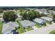 An aerial view of a charming neighborhood with well-maintained homes and green lawns at 3154 Prairie Dunes W Cir, Lakeland, FL 33810