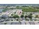 Aerial view of a home with a red arrow pointing to it in a neighborhood at 3154 Prairie Dunes W Cir, Lakeland, FL 33810