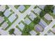 Aerial view of houses on lots of various sizes with neatly manicured lawns and street access at 3154 Prairie Dunes W Cir, Lakeland, FL 33810