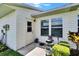 Back porch area leads to backyard with manicured garden and green space at 3154 Prairie Dunes W Cir, Lakeland, FL 33810