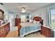 Well-lit bedroom with light blue walls, multiple dressers, and white trim at 3154 Prairie Dunes W Cir, Lakeland, FL 33810