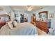 Bedroom with a decorative dresser and sliding glass doors to the living room at 3154 Prairie Dunes W Cir, Lakeland, FL 33810