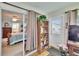 Bedroom with sliding doors, bookshelf, and an outside entrance at 3154 Prairie Dunes W Cir, Lakeland, FL 33810