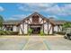 Clubhouse exterior featuring Tudor architecture and accessible parking at 3154 Prairie Dunes W Cir, Lakeland, FL 33810