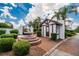 Charming guardhouse with a decorative fountain at the community entrance at 3154 Prairie Dunes W Cir, Lakeland, FL 33810