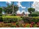Beautiful Highland Fairways entrance with colorful flowers and brick walls at 3154 Prairie Dunes W Cir, Lakeland, FL 33810