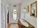 Inviting entryway with a decorative door and stylish accent table with lamp at 3154 Prairie Dunes W Cir, Lakeland, FL 33810