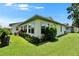 Beautiful exterior with lush green lawn and well-maintained landscaping at 3154 Prairie Dunes W Cir, Lakeland, FL 33810