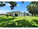 Beautiful exterior featuring green lawn and plenty of shade at 3154 Prairie Dunes W Cir, Lakeland, FL 33810
