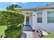 Beautiful front entrance with walkway and decorative features, enhanced by lush landscaping at 3154 Prairie Dunes W Cir, Lakeland, FL 33810