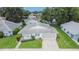 Attractive single-story home featuring a screened garage, blue shutters, and manicured front lawn at 3154 Prairie Dunes W Cir, Lakeland, FL 33810