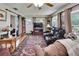 Comfortable living room with recliner seating, natural light, and an exterior door at 3154 Prairie Dunes W Cir, Lakeland, FL 33810