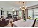 Bright living room featuring cozy seating, ceiling fan, and natural light throughout at 3154 Prairie Dunes W Cir, Lakeland, FL 33810