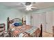 Relaxing primary bedroom features a ceiling fan and closet space at 3154 Prairie Dunes W Cir, Lakeland, FL 33810
