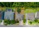 This aerial view shows a home with a concrete driveway, fenced yard, and nearby pool at 3334 Fawnwood Dr, Ocoee, FL 34761
