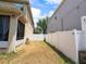 Fenced backyard with grass, showcasing the property's outdoor space at 3334 Fawnwood Dr, Ocoee, FL 34761