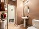 Modern bathroom showcasing a pedestal sink, stylish fixtures, and a clean, minimalist design at 3334 Fawnwood Dr, Ocoee, FL 34761