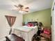 Comfortable bedroom features a ceiling fan, decorative accents, and soft natural light at 3334 Fawnwood Dr, Ocoee, FL 34761