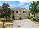 Inviting two-story home with a spacious driveway, two-car garage, and a beautifully landscaped front yard at 3334 Fawnwood Dr, Ocoee, FL 34761