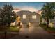 Charming two-story home with a well-manicured lawn, a two-car garage, and inviting curb appeal at 3334 Fawnwood Dr, Ocoee, FL 34761