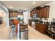 Spacious kitchen featuring stainless steel appliances, dark cabinets, and a breakfast bar at 3334 Fawnwood Dr, Ocoee, FL 34761