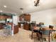 Open kitchen with dark wood cabinetry, stainless steel appliances, and breakfast bar seating at 3334 Fawnwood Dr, Ocoee, FL 34761