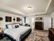 Serene main bedroom features a tray ceiling, neutral tones, and an ensuite bathroom at 3334 Fawnwood Dr, Ocoee, FL 34761