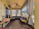 Enclosed patio with brick flooring, comfortable furniture, and ceiling fan for outdoor living at 3334 Fawnwood Dr, Ocoee, FL 34761