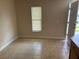 An open dining area featuring tile flooring and natural light from a window at 340 W Stanford St, Bartow, FL 33830