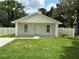 Charming single-story home featuring a quaint front porch and well-maintained lawn at 340 W Stanford St, Bartow, FL 33830