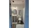 Compact bathroom with pedestal sink, decorative mirror, and shower at 4140 Old Dixie Hwy, Auburndale, FL 33823