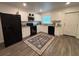 Updated kitchen featuring white cabinetry, granite countertops, and stainless steel appliances at 4140 Old Dixie Hwy, Auburndale, FL 33823