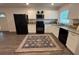Well-lit kitchen featuring modern appliances and a stylish decorative rug at 4140 Old Dixie Hwy, Auburndale, FL 33823