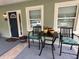 Inviting front porch with seating area, perfect for enjoying the outdoors at 4140 Old Dixie Hwy, Auburndale, FL 33823