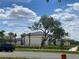 Osceola County Fire Rescue building with green landscape, sidewalks and mature tree at 4151 Boggy Creek Rd, Kissimmee, FL 34744