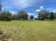 Grassy residential land with mature trees and open space at 4151 Boggy Creek Rd, Kissimmee, FL 34744
