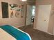Bedroom with a closet and nautical wall decor, leads to the dining area at 4805 Oak Acres Dr, Lake Wales, FL 33898