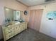 Bedroom featuring double closet doors and dresser with a mirror at 4805 Oak Acres Dr, Lake Wales, FL 33898