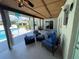 Outdoor covered patio with comfortable seating, ceiling fans, and backyard view at 4805 Oak Acres Dr, Lake Wales, FL 33898