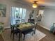 Cozy dining room with a dining set, slider to the patio, and neutral color palette at 4805 Oak Acres Dr, Lake Wales, FL 33898