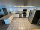 Bright kitchen featuring granite countertops, stainless steel appliances, and white cabinetry at 4805 Oak Acres Dr, Lake Wales, FL 33898