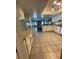 Open kitchen overlooking the living area, enhanced with tile flooring and white cabinets at 4805 Oak Acres Dr, Lake Wales, FL 33898