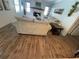 Cozy living room with a fireplace, wood-look tile floors, and comfortable seating at 4805 Oak Acres Dr, Lake Wales, FL 33898