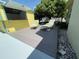 Outdoor poolside bar with yellow siding, surrounded by lounge chairs and lush landscaping at 4805 Oak Acres Dr, Lake Wales, FL 33898
