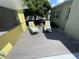 Relaxing outdoor patio featuring lounge chairs, adjacent to a stylish yellow poolside bar for enjoyment at 4805 Oak Acres Dr, Lake Wales, FL 33898