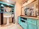 Charming bathroom featuring custom vanity with a vessel sink, decorative mirror, and stylish accents at 4966 Foxrun Ln, Lakeland, FL 33813
